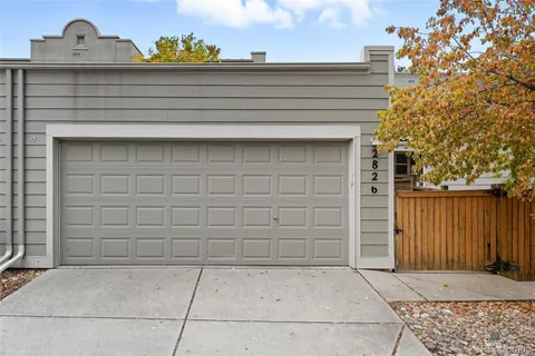 an aerial view of residential houses with yard