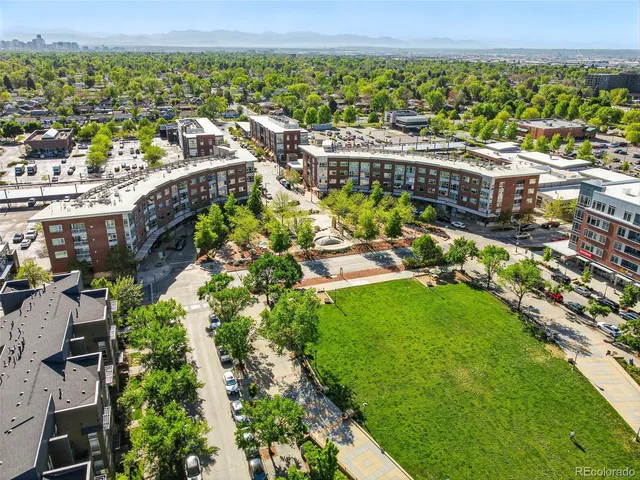 a view of multiple house with outdoor seating