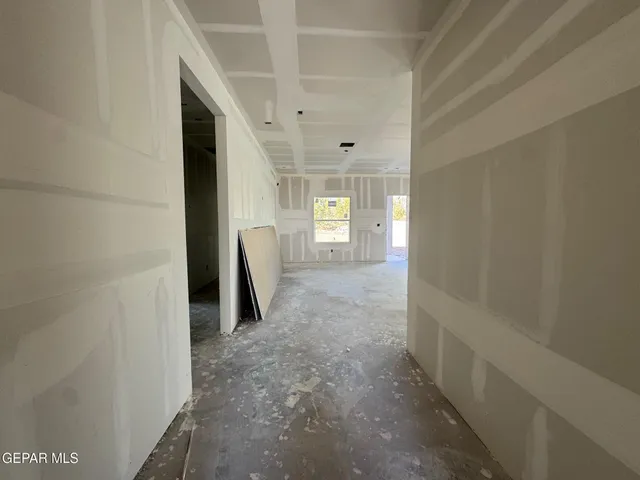 a view of livingroom and an empty room