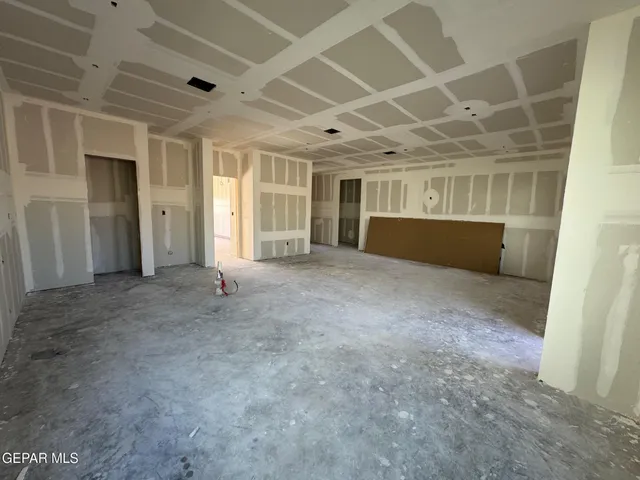 a view of empty room with windows