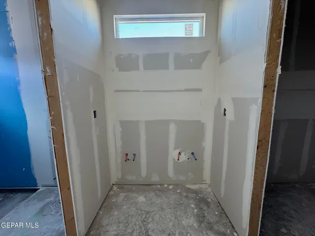 hallway view with wooden door