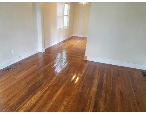 69 Lyons Street Springfield, MA 01151 - Photo 8 of 11 a view of empty room with wooden floor
