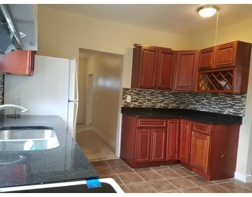 69 Lyons Street Springfield, MA 01151 - Photo 10 of 11 a kitchen with granite countertop a refrigerator and a sink