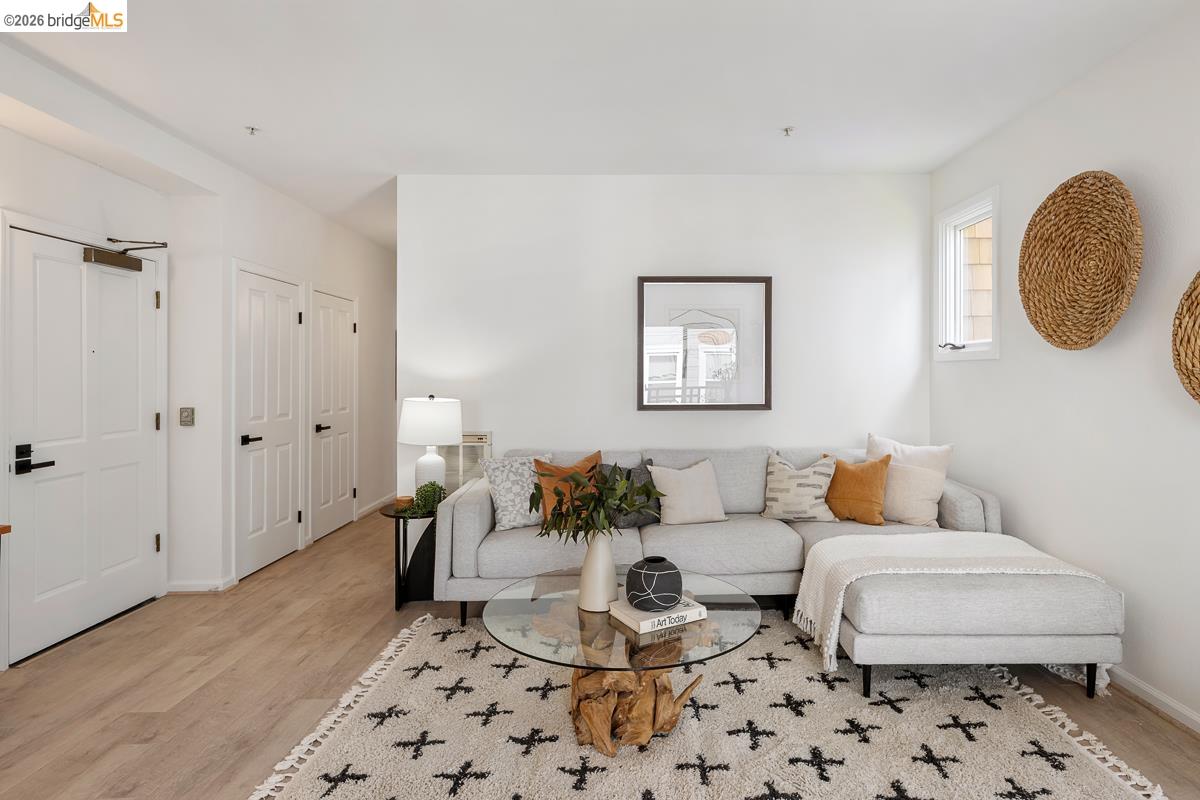 2029 Channing Way, Unit 3D Berkeley, CA 94704 - Photo 4 of 54 Living area featuring light wood-finish flooring and white walls