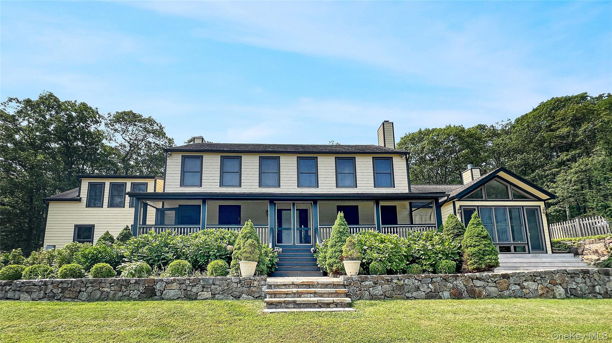 701 Highway 301 Cold Spring, NY 10516 - Photo 1 of 19 a front view of a house with a yard