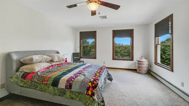 a bedroom with a large bed and a window