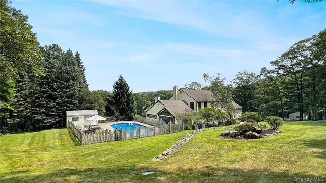 a view of swimming pool with seating space