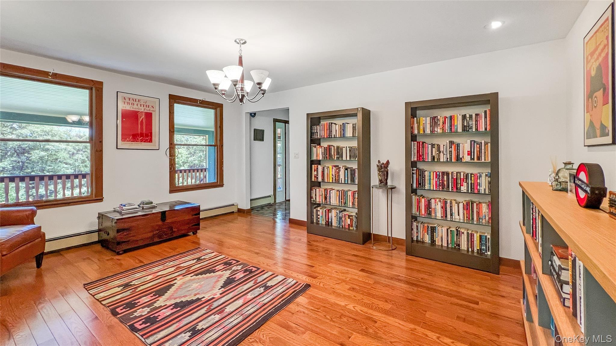 701 Highway 301 Cold Spring, NY 10516 - Photo 6 of 19 a living room with furniture and a book shelf