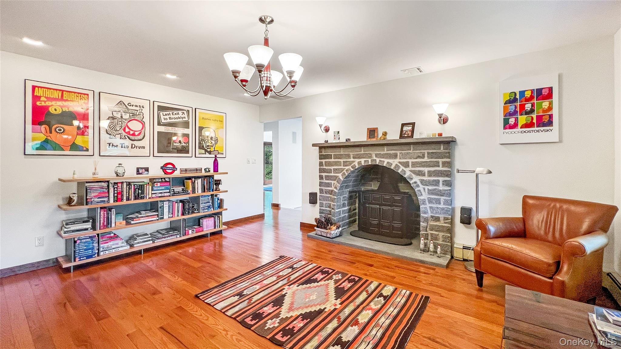 701 Highway 301 Cold Spring, NY 10516 - Photo 7 of 19 a living room with furniture a flat screen tv and a fireplace