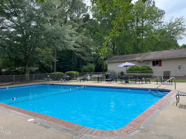 a view of a swimming pool with a patio
