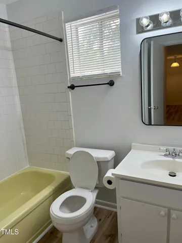 a view of house with car park