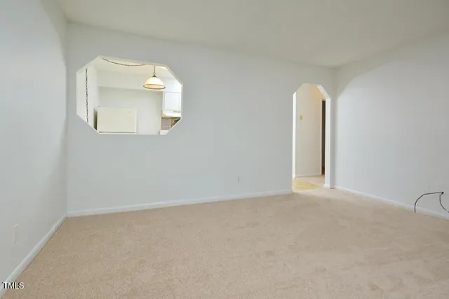 an empty room with a bathroom