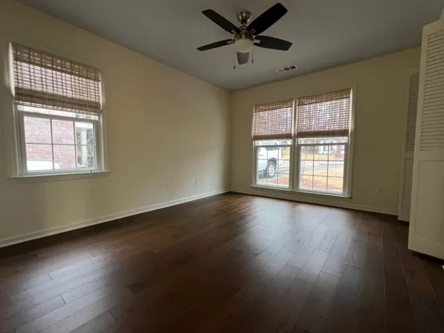 a spacious bathroom with double sink large mirror and vanity