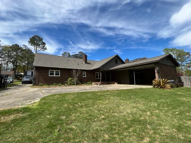3636 Denewood Court Columbus, GA 31909 - Photo 19 of 26 a front view of a house with a yard