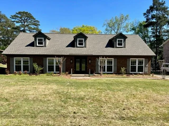 front view of a house with a yard