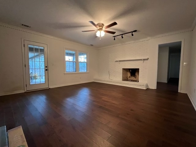 3636 Denewood Court Columbus, GA 31909 - Photo 8 of 26 a view of an empty room with wooden floor fireplace and a window