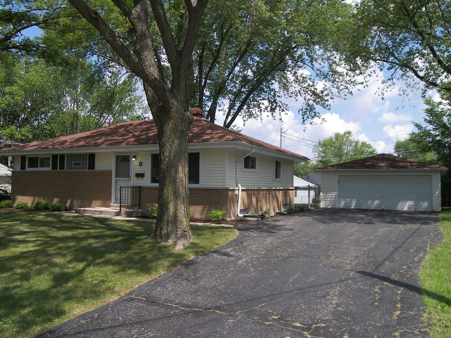 8 Crescent Road Lake Zurich, IL 60047 - Photo 2 of 17 front view of a house with a yard