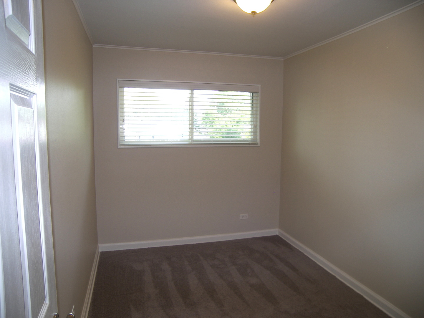 8 Crescent Road Lake Zurich, IL 60047 - Photo 14 of 17 an empty room with wooden floor and windows