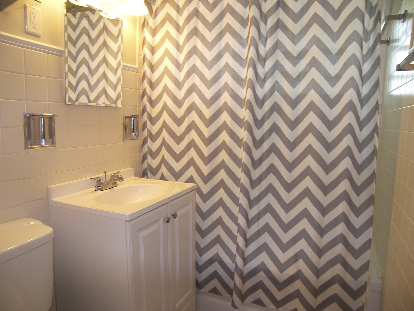 8 Crescent Road Lake Zurich, IL 60047 - Photo 5 of 17 a bathroom with a sink and a mirror