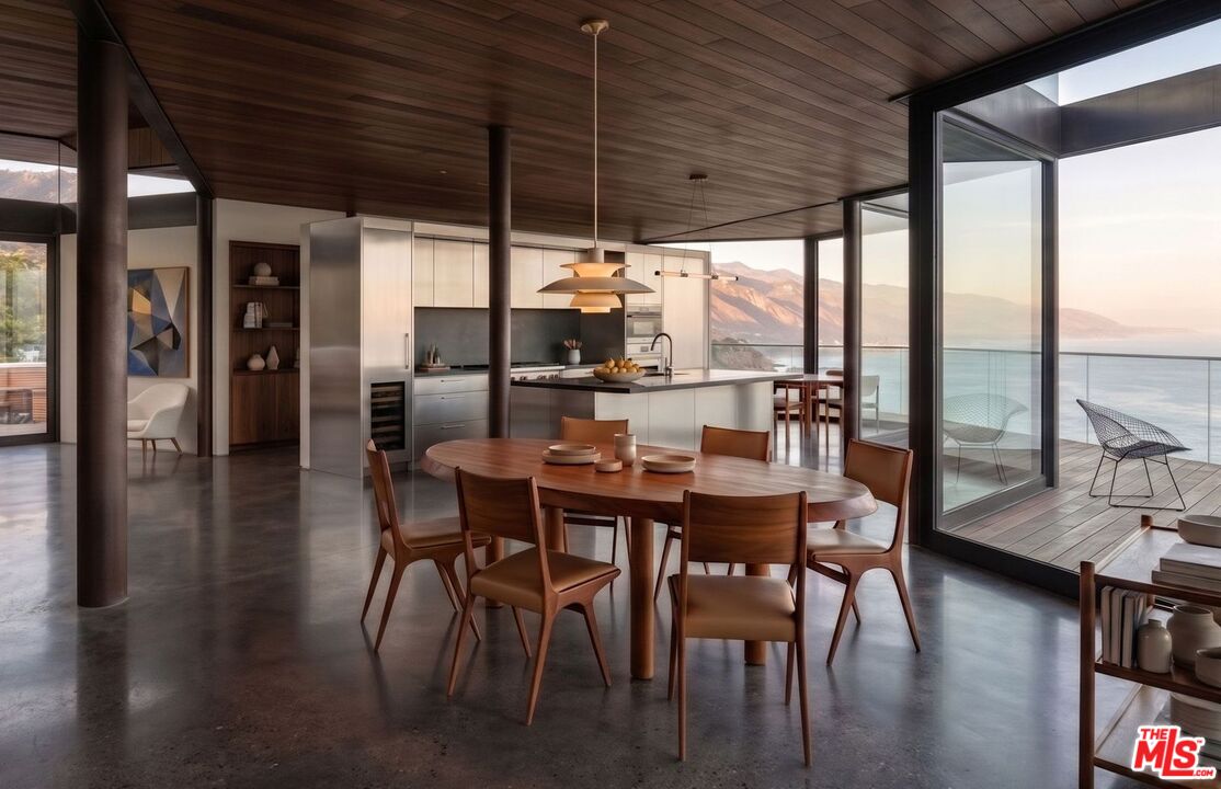 30000 Zenith Point Road Malibu, CA 90265 - Photo 15 of 15 a dining room with furniture window and wooden floor