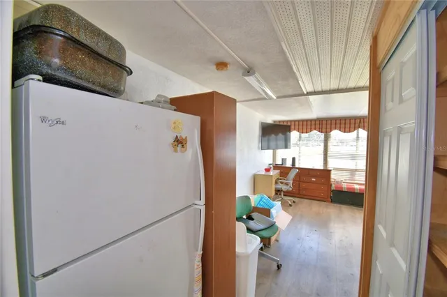 a white refrigerator freezer sitting in a kitchen