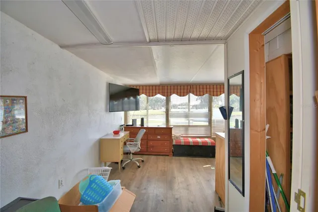 a room with furniture and a window