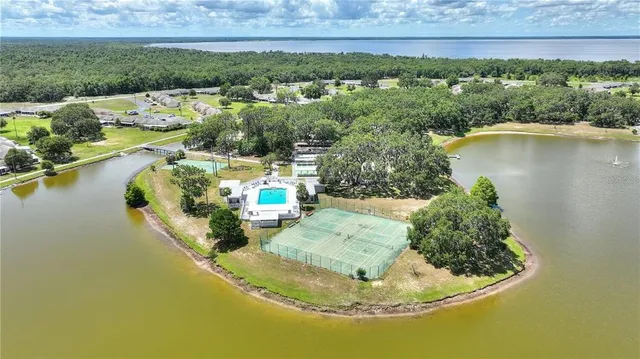 a view of a lake with a house in the background