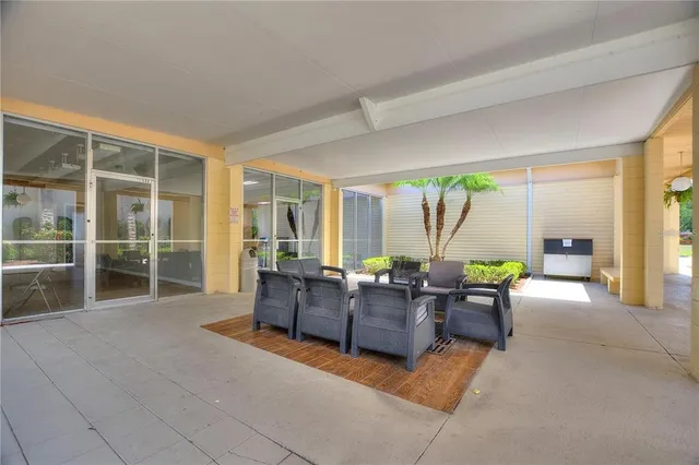 a view of backyard with seating area and trees