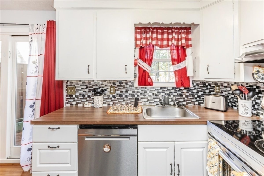 75 Sandy Pond Road, Unit 7 Ayer, MA 01432 - Photo 14 of 37 a kitchen with a sink and a stove