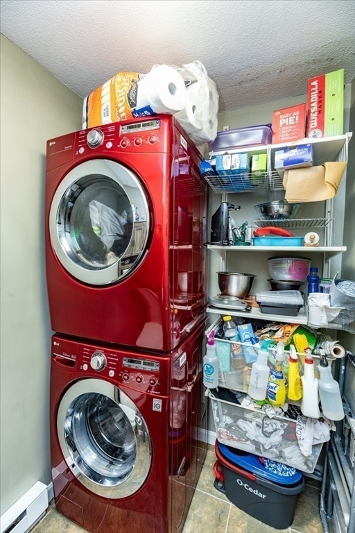 75 Sandy Pond Road, Unit 7 Ayer, MA 01432 - Photo 16 of 37 a utility room with dryer and washer
