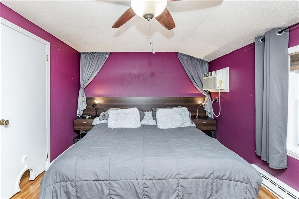 75 Sandy Pond Road, Unit 7 Ayer, MA 01432 - Photo 19 of 37 a bedroom with a bed and window