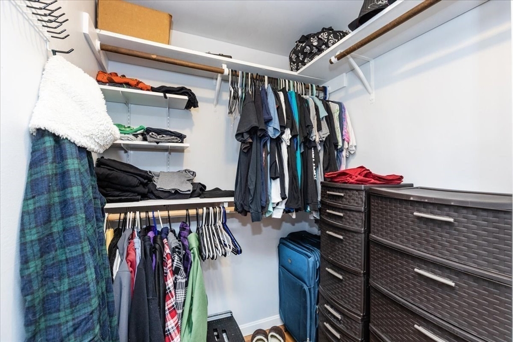 75 Sandy Pond Road, Unit 7 Ayer, MA 01432 - Photo 22 of 37 a view of walk in closet with clothes and shoes