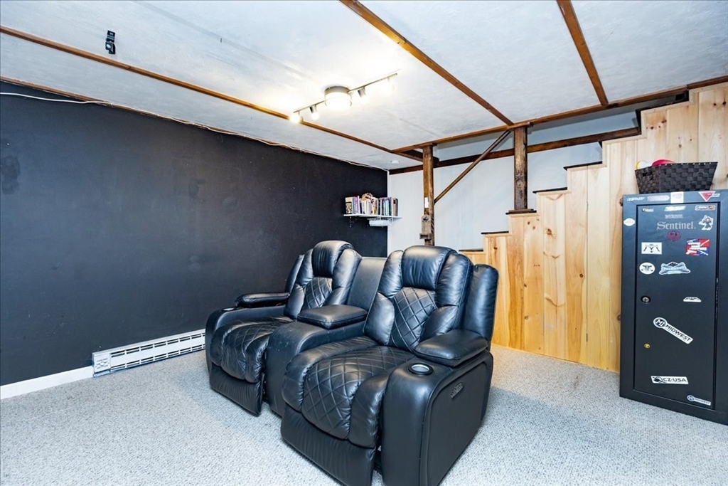 75 Sandy Pond Road, Unit 7 Ayer, MA 01432 - Photo 29 of 37 a bed room with a bed and a walk in closet