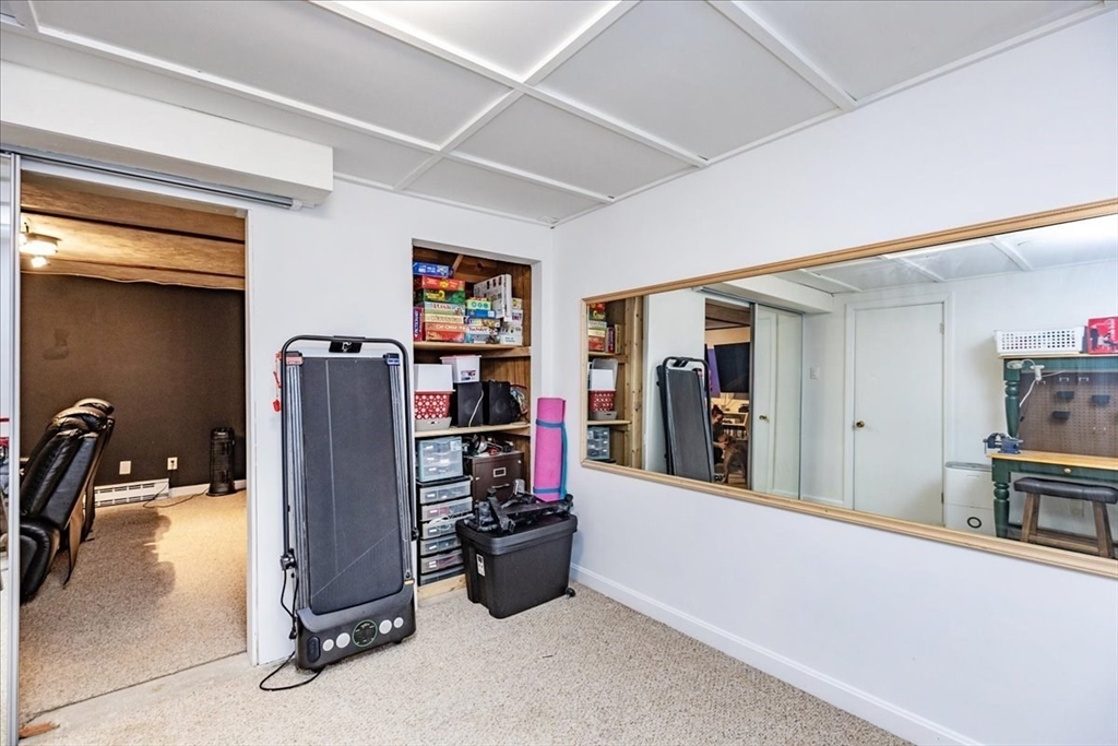 75 Sandy Pond Road, Unit 7 Ayer, MA 01432 - Photo 30 of 37 a view of a room with gym equipment