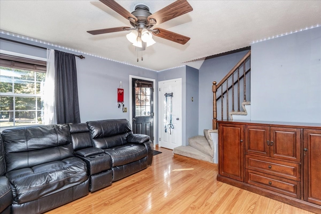 75 Sandy Pond Road, Unit 7 Ayer, MA 01432 - Photo 5 of 37 a living room with furniture and a window