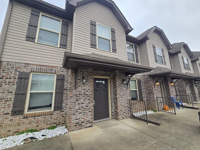 a front view of a house with garage