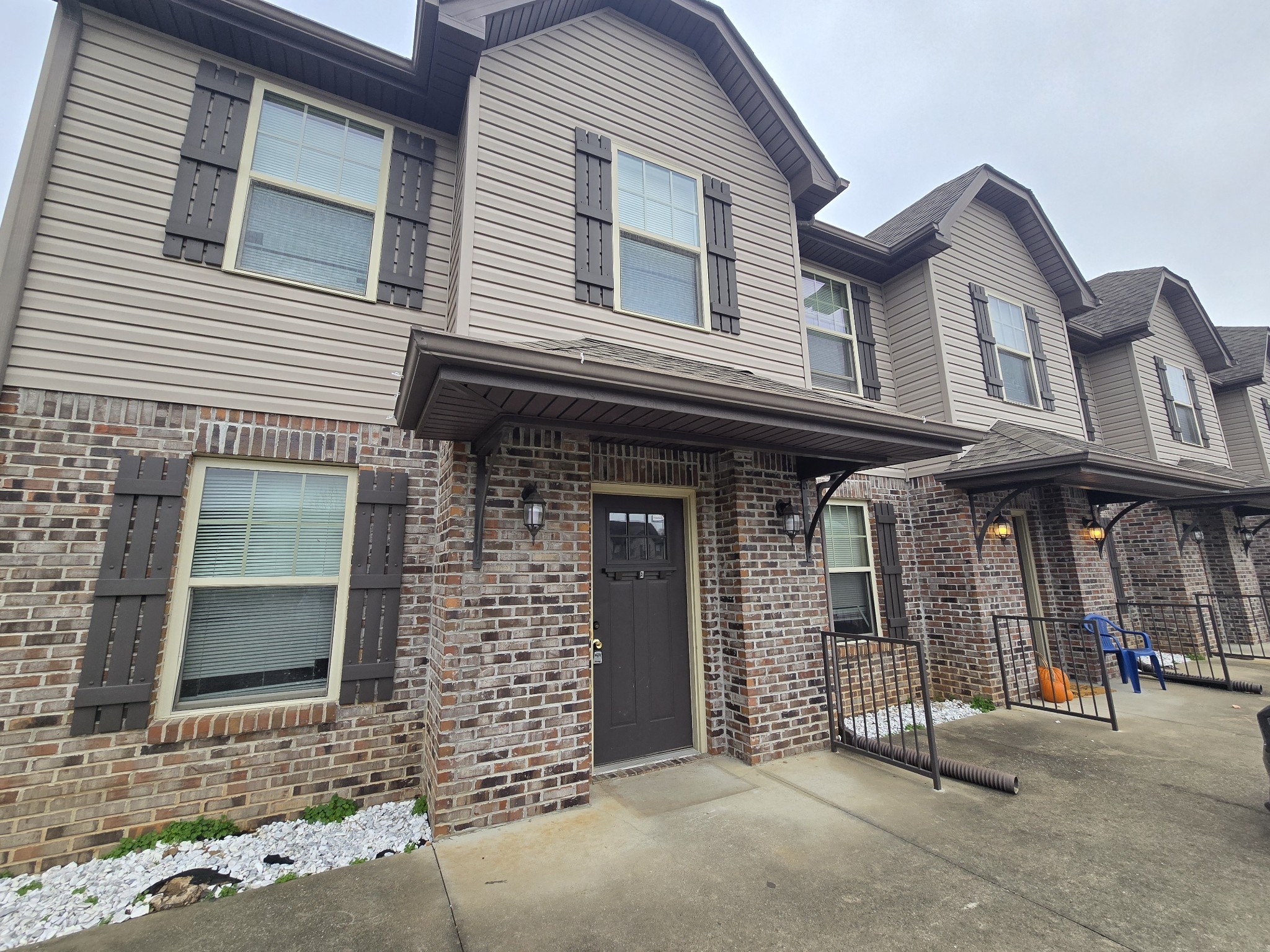 a front view of a house with garage