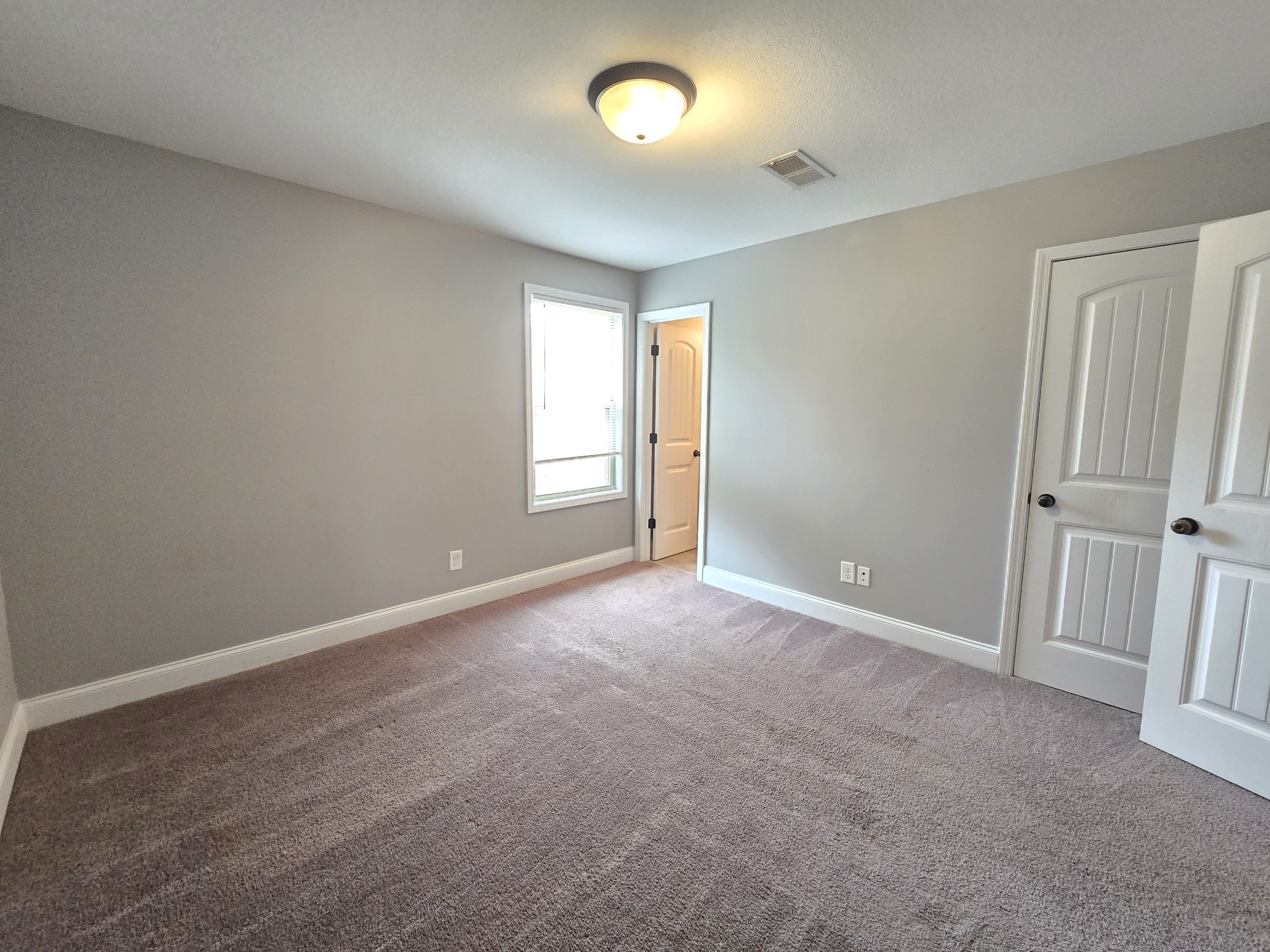 1771 Spring Water Drive, Unit B Clarksville, TN 37040 - Photo 17 of 18 a view of an empty room with a window