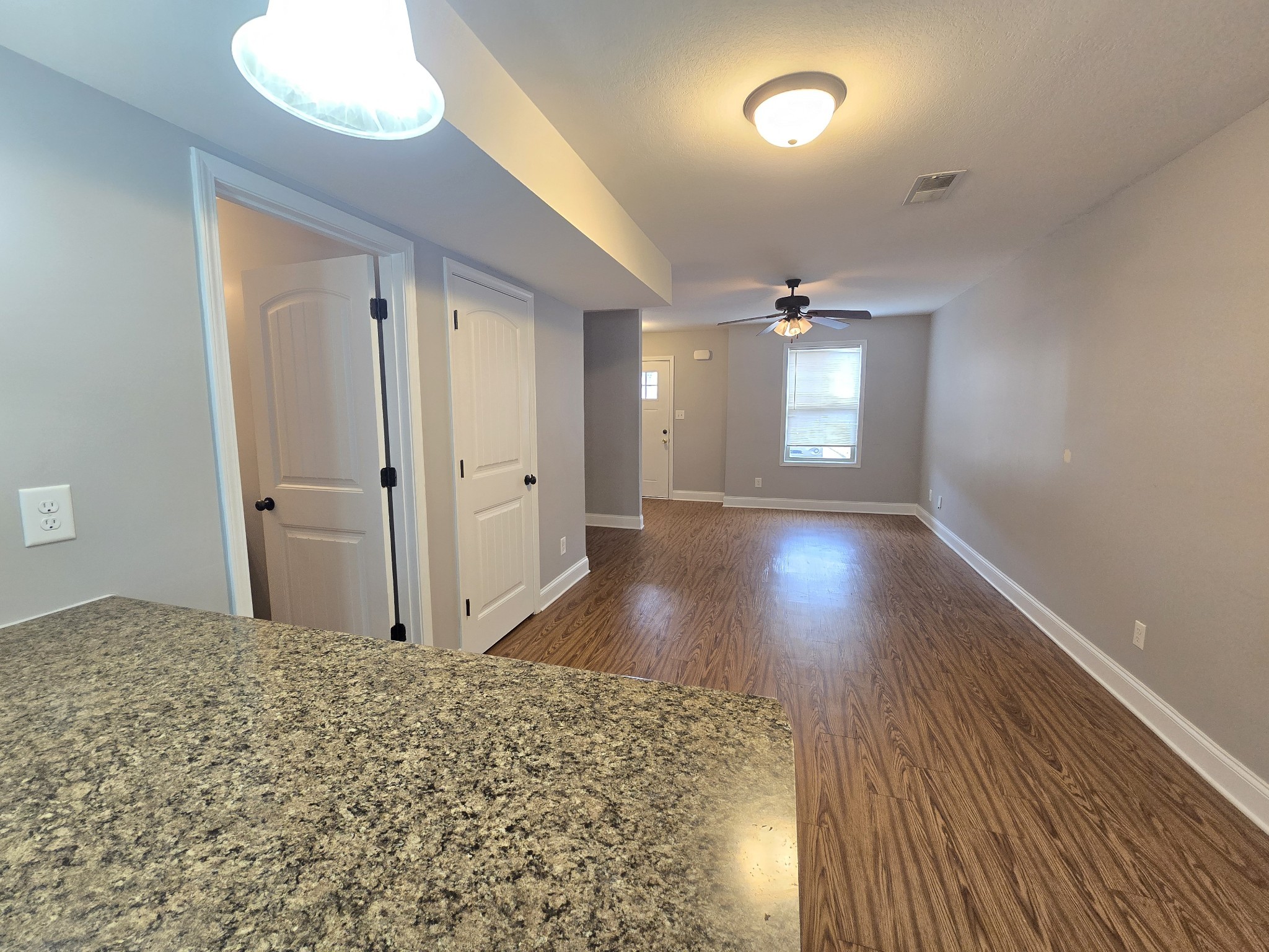 1771 Spring Water Drive, Unit B Clarksville, TN 37040 - Photo 8 of 18 an empty room with wooden floor and windows