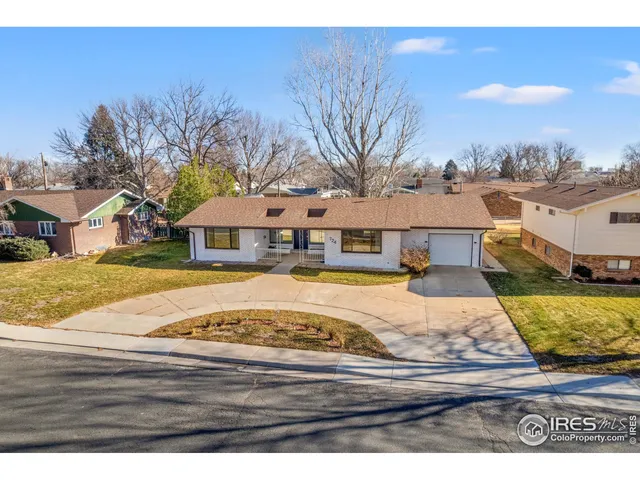 a house with swimming pool in front of it