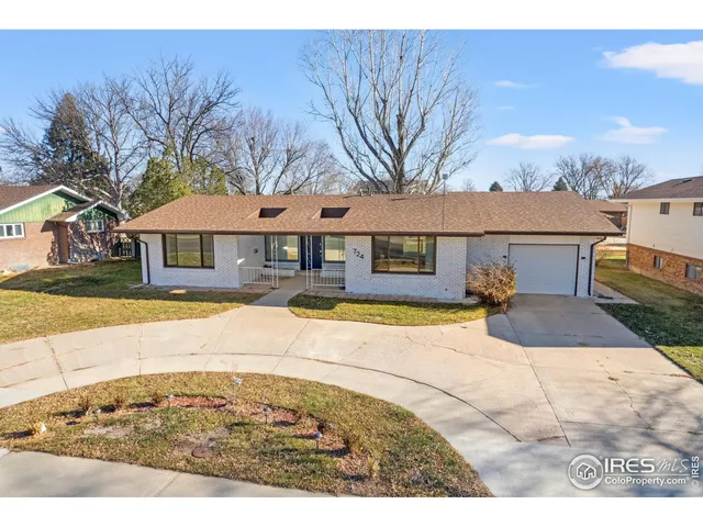 a house view with a swimming pool and wooden fence