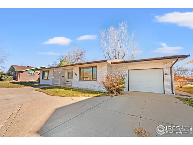 a front view of a house with yard