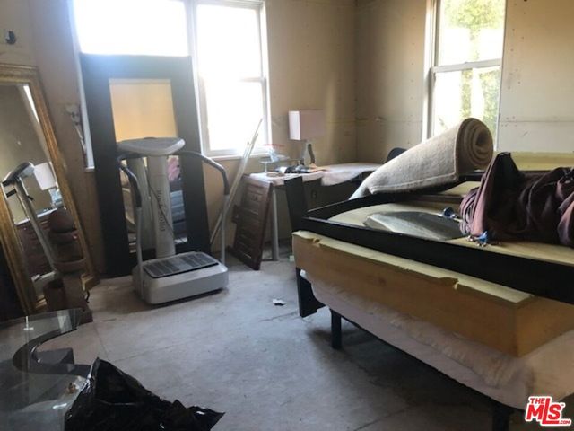 a bed room with furniture and a window