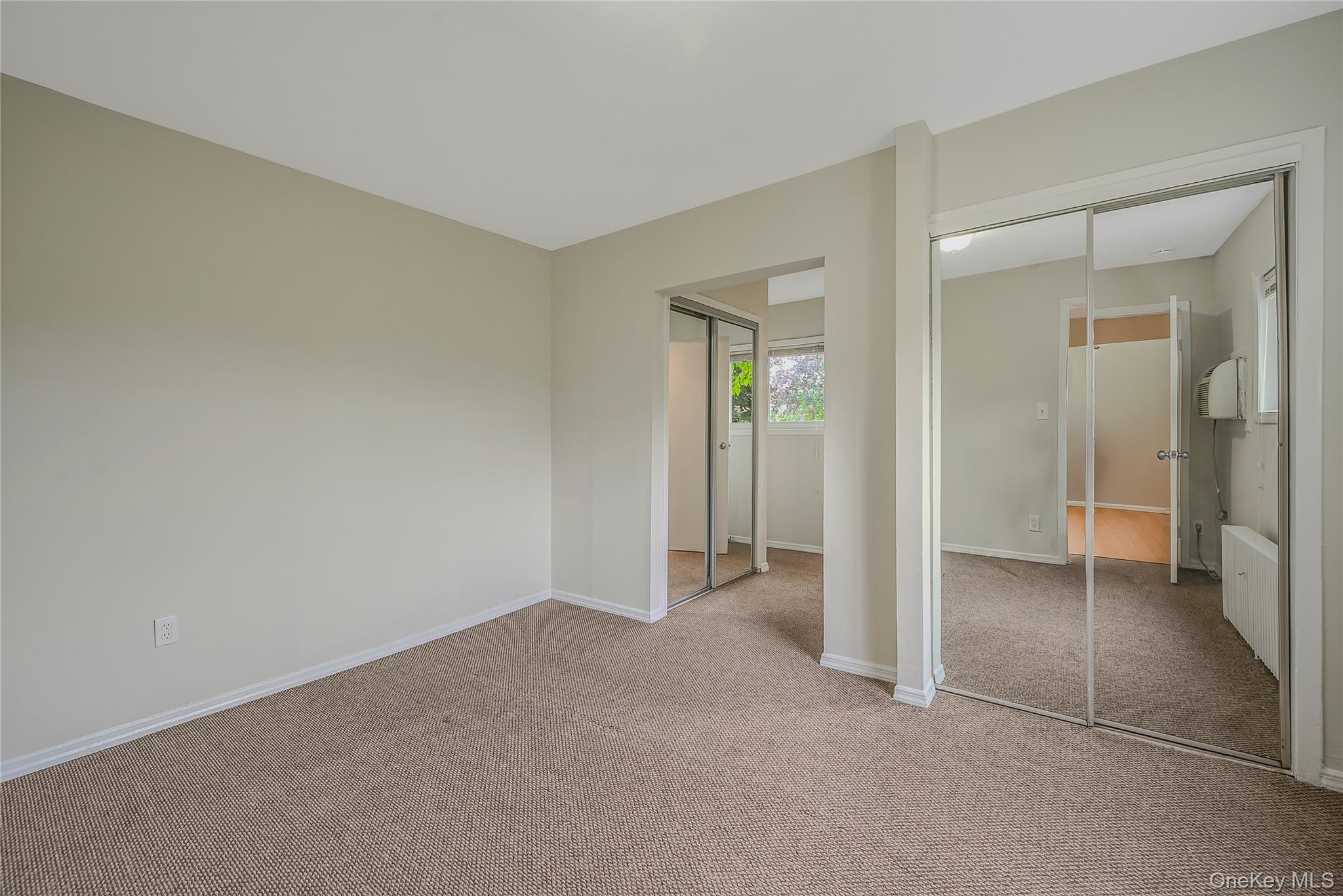 148 South 4th Street Bethpage, NY 11714 - Photo 12 of 16 an empty room with closet and a bathroom