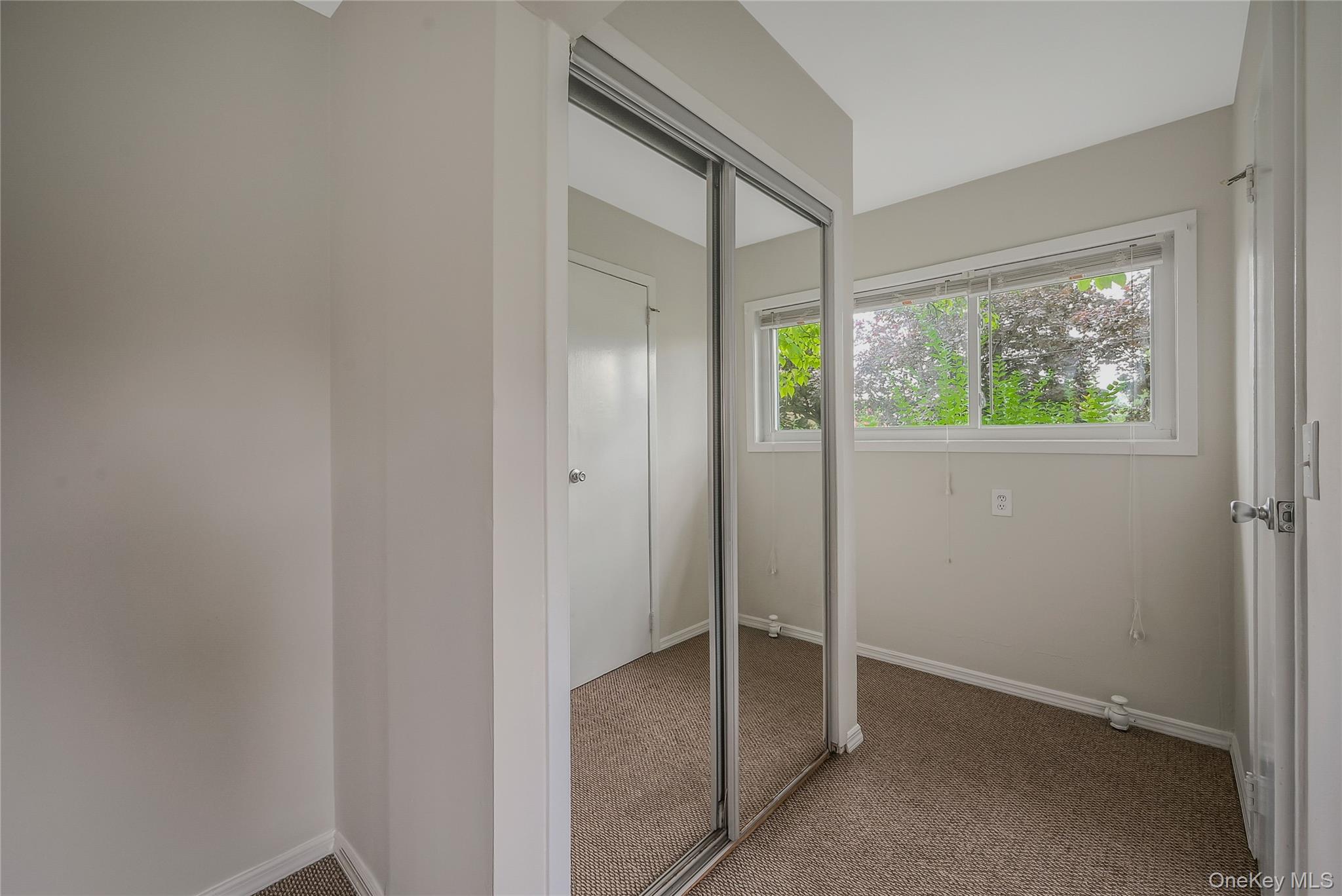 148 South 4th Street Bethpage, NY 11714 - Photo 14 of 16 an empty room with windows and closet