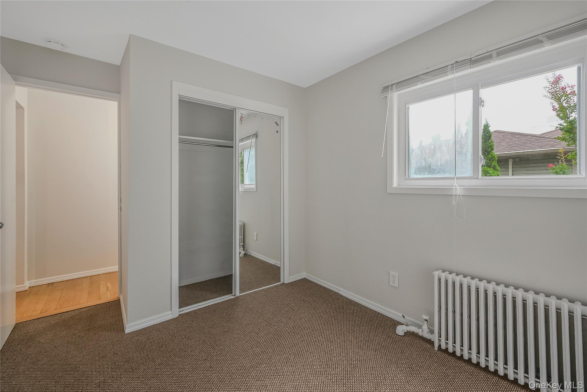 148 South 4th Street Bethpage, NY 11714 - Photo 10 of 16 a view of empty room with windows