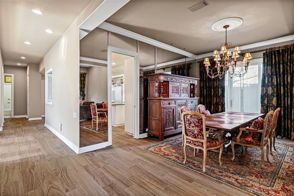 8908 Brierfield Road Granbury, TX 76049 - Photo 8 of 40 a view of a dining room with furniture window and wooden floor