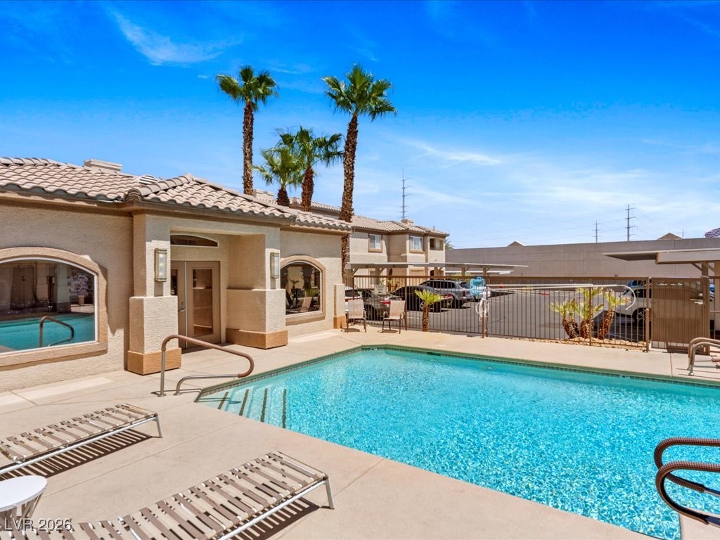 8725 West Flamingo Road, Unit 235 Las Vegas, NV 89147 - Photo 2 of 22 Community pool featuring a patio area