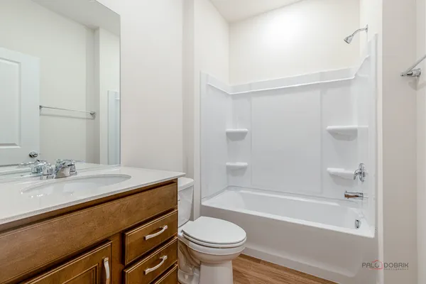 a bathroom with a sink a toilet and a bathtub