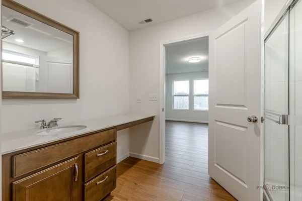 a view of a kitchen from the hallway